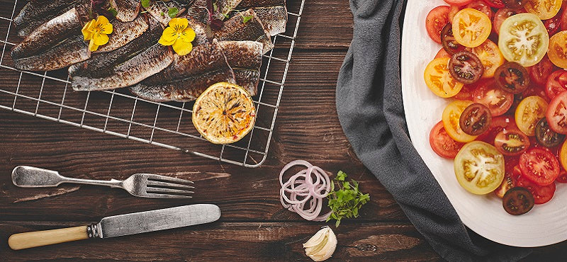 Grilled butterflied sardines with heritage tomatoes, basil salad and lemon salsa