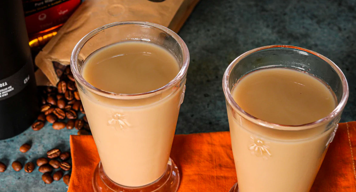Image of two glasses filled with White Russian cocktail